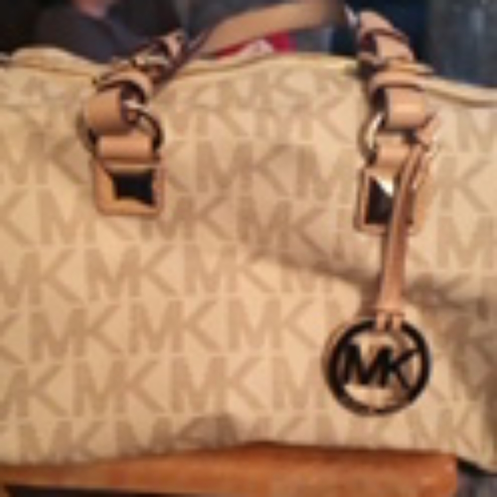MK tan and white purse